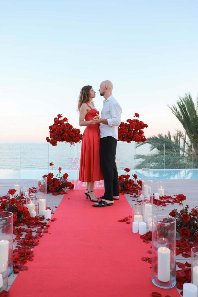 Sunset engagement proposal with luxury setup on Barcelona’s coastline.