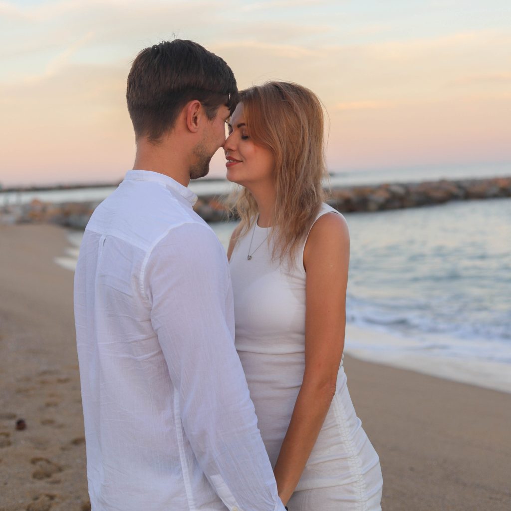 A couple celebrates their engagement at the Barcelona Beach