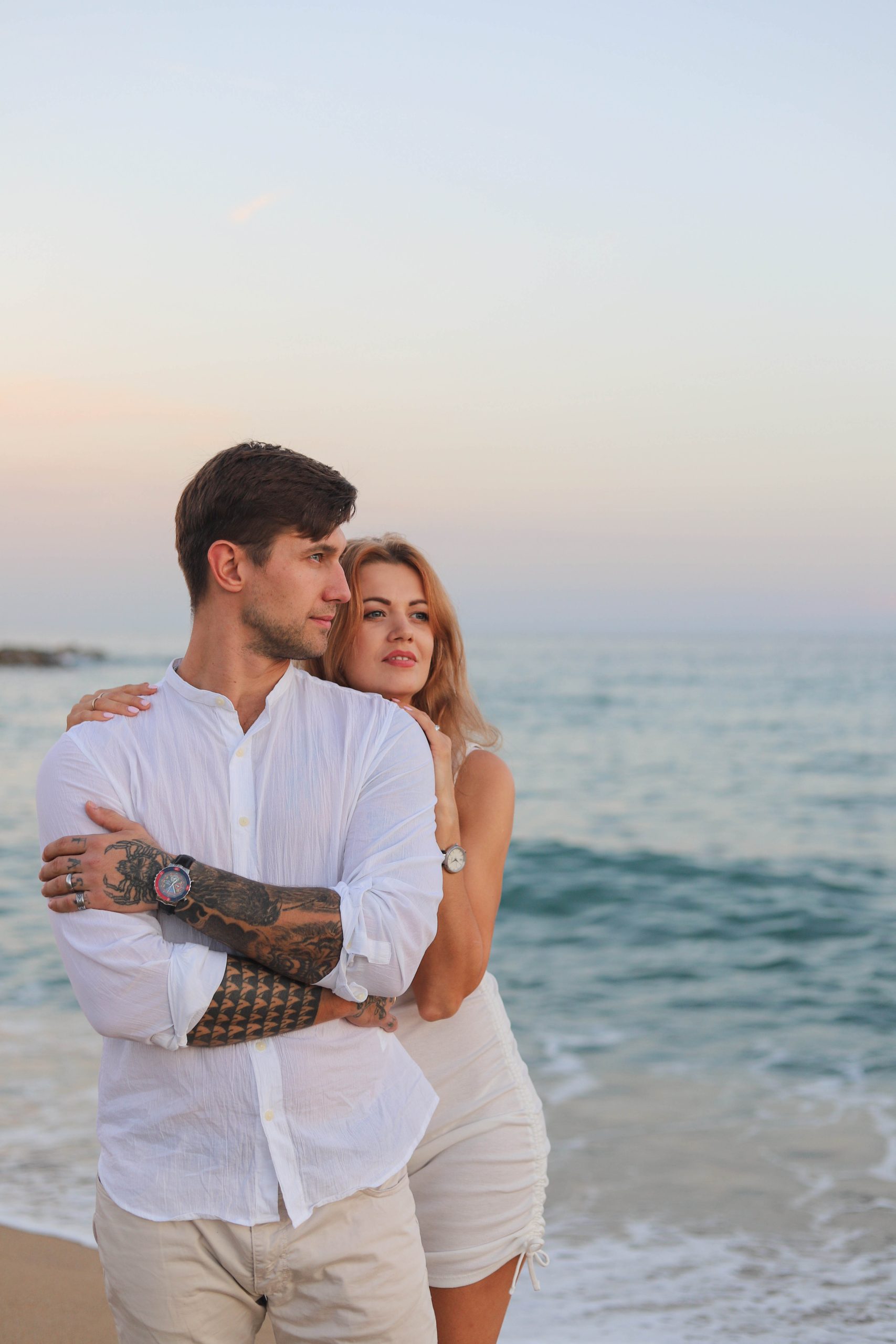 Man proposing on Barceloneta Beach at sunset