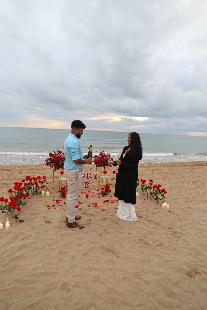 Romantic seaside proposal Barcelona with floral decoration