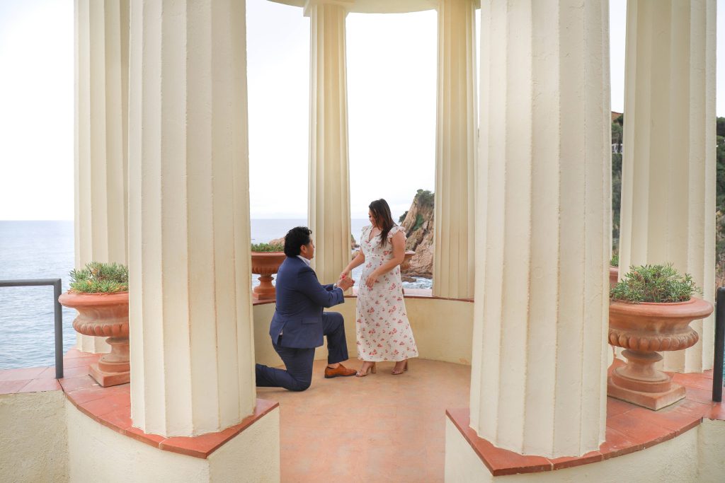 Man proposing on one knee at Marimurtra garden in Costa Brava
