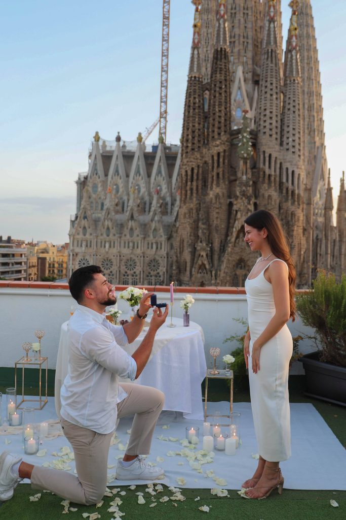 Romantic marriage proposal on a private terrace with Sagrada Família view in Barcelona