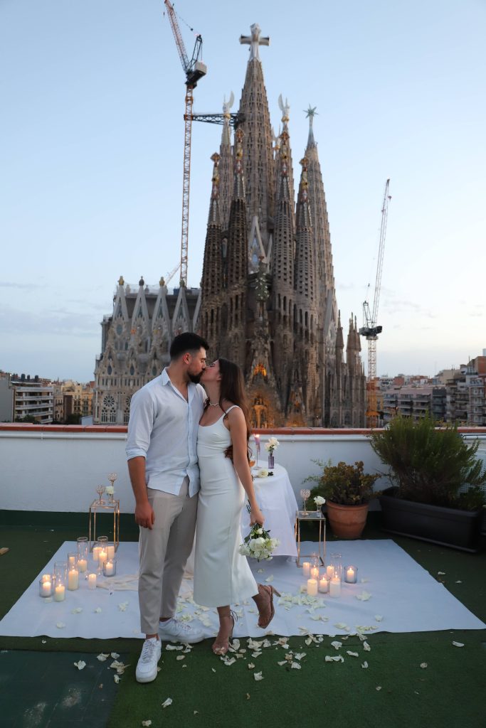 Happy newly engaged couple celebrating after a marriage proposal in Barcelona